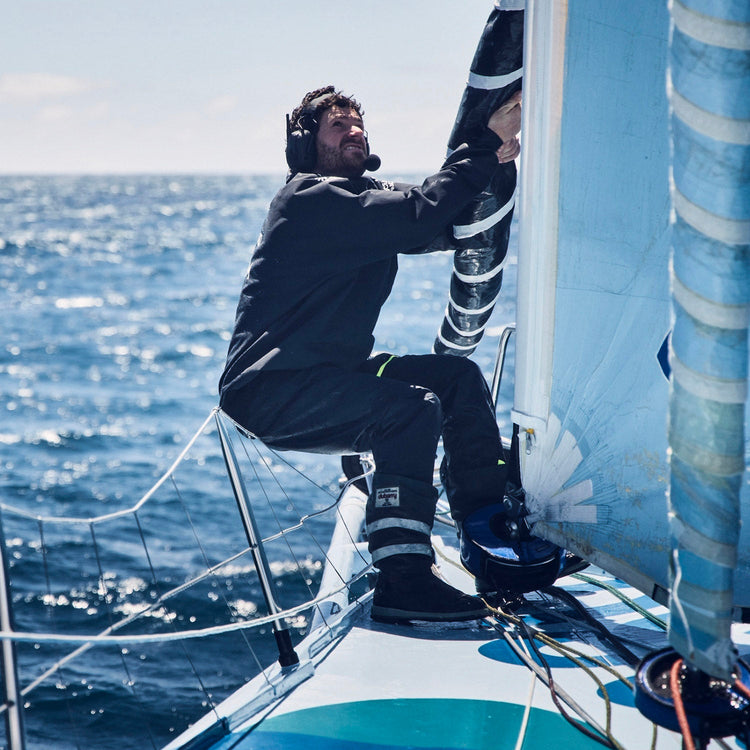 Square image of a member of team Holcim - PRB working on the boat during the Ocean Race 2023.//© Team Holcim - PRB | Anne Beauge